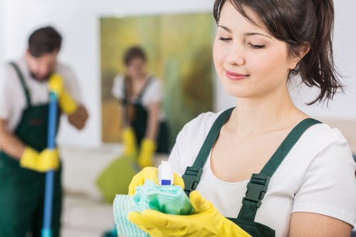 Professional cleaner maintaining a shared hallway in a building