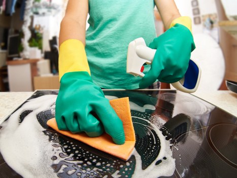 Professional domestic cleaning in a bright modern kitchen
