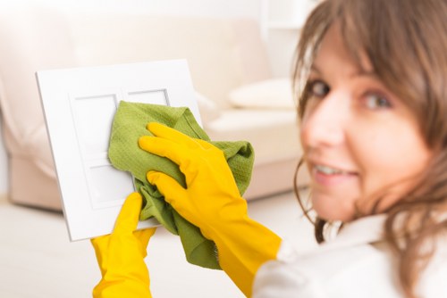 Cleaning team preparing a newly renovated room after builders